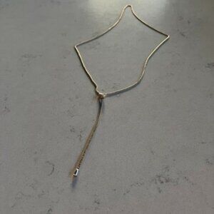 Knotted Y-Shaped Long Gold Necklace.